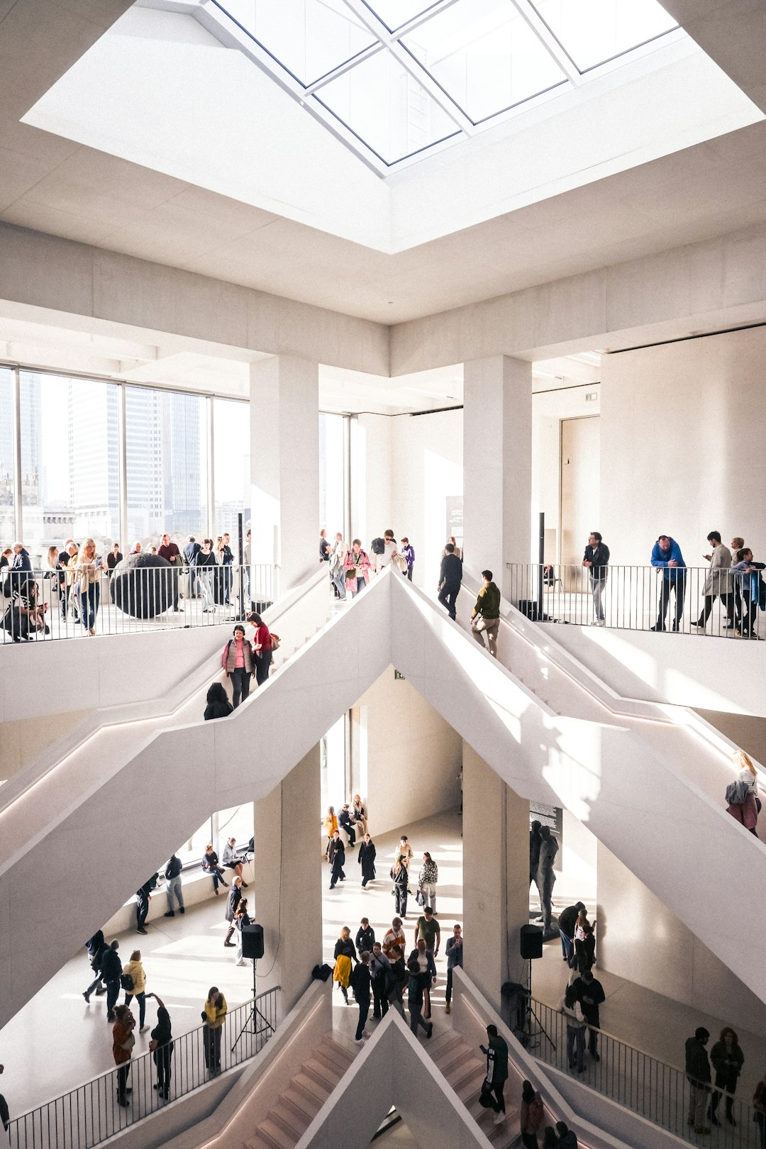 A large group of people walking around a building