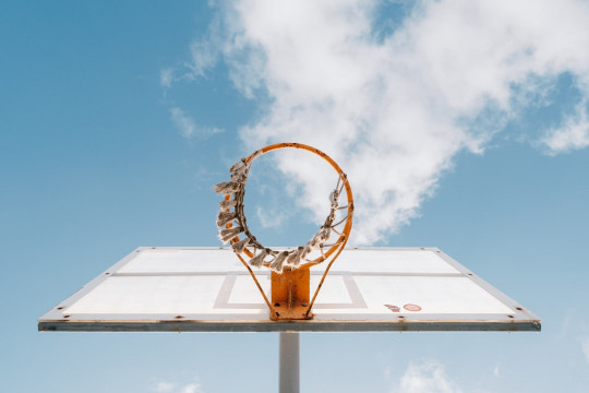 A basketball hoop with a basketball inside of it