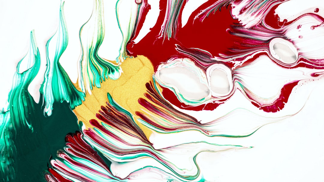 An abstract painting of red, green, and yellow colors