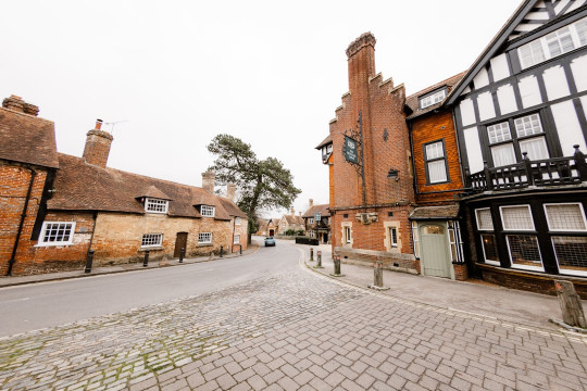 A cobblestone street lined with old buildings