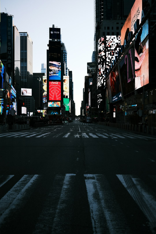 A city street filled with lots of tall buildings