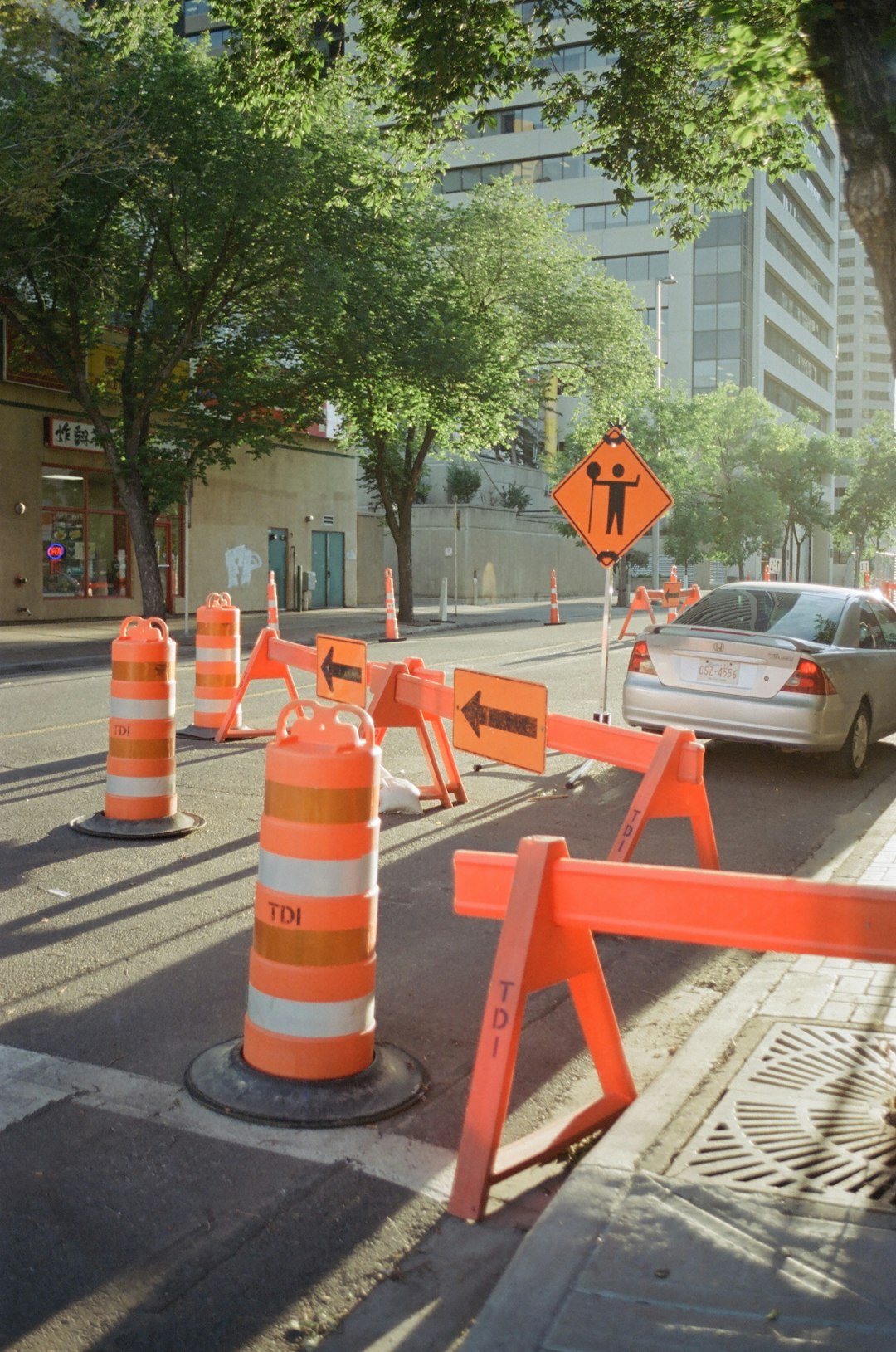 A street that has a bunch of traffic cones on it