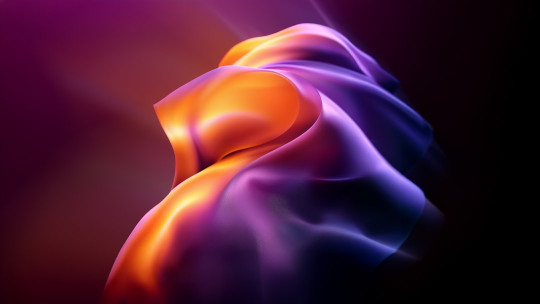 A blurry image of an orange and purple object