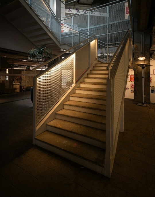 A staircase leading up to the top floor of a building