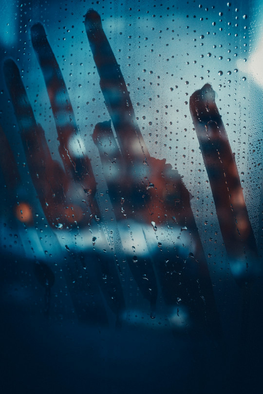 A close up of a window with rain drops