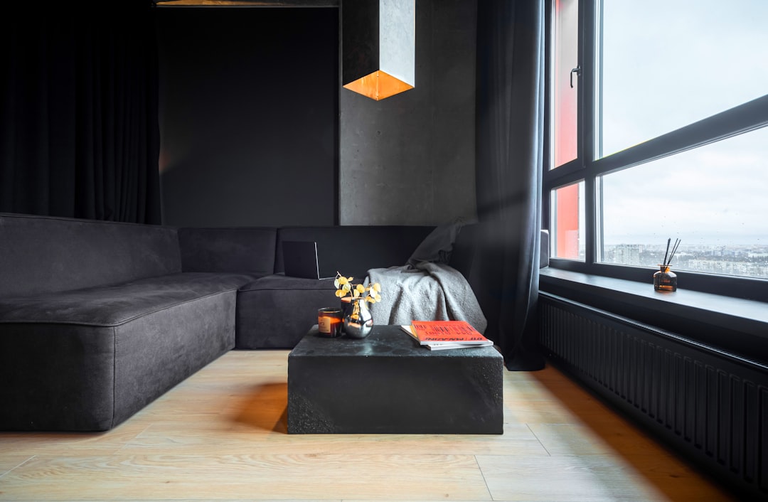 A living room with a large window and a couch