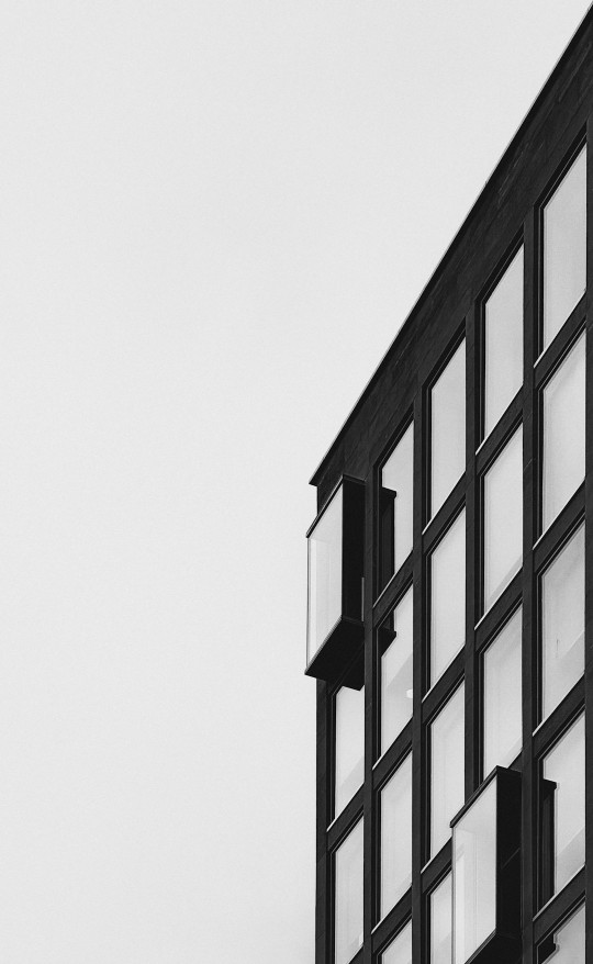 A black and white photo of a tall building